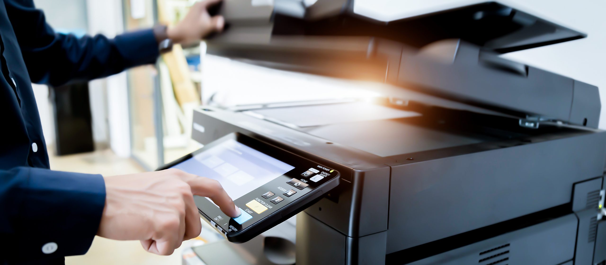 Bussiness man Hand press button on panel of printer, printer scanner laser office copy machine supplies start concept.