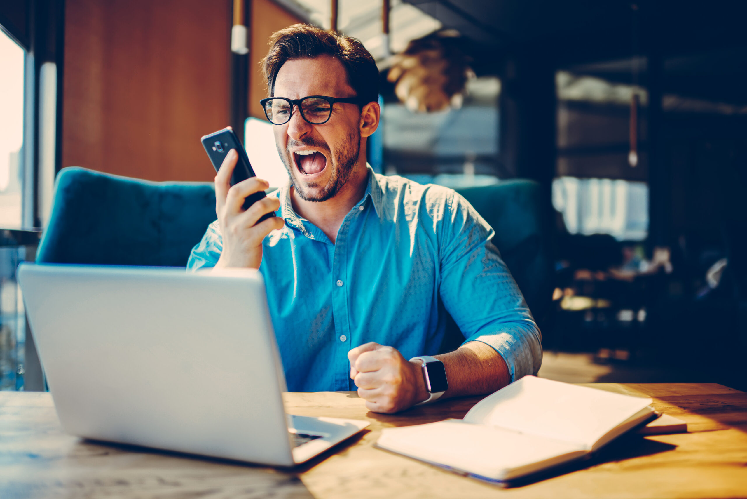 Dissatisfied businessman is angry during telephone conversation